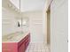 Bathroom featuring a double vanity, modern fixtures, and a closet for storage at 917 E Lexington Ave, Gilbert, AZ 85234