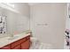 Clean bathroom featuring a vanity with single sink, toilet, and shower at 917 E Lexington Ave, Gilbert, AZ 85234