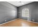 Bedroom featuring gray walls, laminate floor, one window and neutral blinds at 917 E Lexington Ave, Gilbert, AZ 85234
