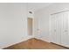 Bedroom featuring white walls, laminate floor, a closet and bright lighting at 917 E Lexington Ave, Gilbert, AZ 85234