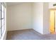 Vacant bedroom features natural light, neutral carpeting and paint and an open doorway to the bathroom at 921 W University Dr # 1191, Mesa, AZ 85201