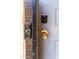 Close-up of modern door hardware with a smart doorbell and secure lock at 921 W University Dr # 1191, Mesa, AZ 85201