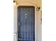 Close-up of a secure front door with elegant details and hardware at 921 W University Dr # 1191, Mesa, AZ 85201