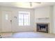 Bright living room with a cozy fireplace and a view of the outdoors at 921 W University Dr # 1191, Mesa, AZ 85201