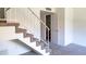View of the carpeted staircase featuring white railings and leading to the upper level of the home at 921 W University Dr # 1191, Mesa, AZ 85201