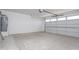 Spacious two car garage ready for parking and storage, featuring a water heater on the left at 9310 W Washington St, Tolleson, AZ 85353