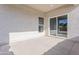 Covered patio with concrete flooring and sliding glass door to home interior at 9310 W Washington St, Tolleson, AZ 85353