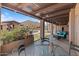 This backyard patio offers ample seating, shade, and a beautiful view of the outdoor spaces at 9607 E Mckellips Rd, Mesa, AZ 85207