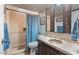 This bathroom is tiled, features vanity storage, a shower, and decorated mirrors at 9607 E Mckellips Rd, Mesa, AZ 85207