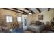 Inviting bedroom featuring a comfortable bed, adjacent dining area, and bathroom access at 9607 E Mckellips Rd, Mesa, AZ 85207