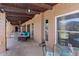 Inviting covered patio area complete with comfortable seating and outdoor dining options for relaxation and entertainment at 9607 E Mckellips Rd, Mesa, AZ 85207
