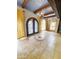 Inviting entryway features a decorative tile inlay, arched front door, and stylish lighting fixtures at 9607 E Mckellips Rd, Mesa, AZ 85207