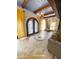 Inviting entryway features a decorative tile inlay, arched front door, and stylish lighting fixtures at 9607 E Mckellips Rd, Mesa, AZ 85207