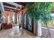 Foyer features tile flooring, ironwork doors, chandelier, and decorative windows at 9607 E Mckellips Rd, Mesa, AZ 85207