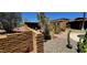 Desert landscape with natural stone walls and brick home at 9607 E Mckellips Rd, Mesa, AZ 85207