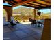 Spacious outdoor patio area with ample seating and a fire pit, perfect for entertaining guests at 9607 E Mckellips Rd, Mesa, AZ 85207