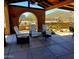 Outdoor patio with covered seating area and desert views at 9607 E Mckellips Rd, Mesa, AZ 85207