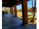 Spacious covered patio offering views of the pool area, desert landscaping, and scenic mountain backdrop at 9607 E Mckellips Rd, Mesa, AZ 85207