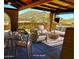 Charming outdoor patio with desert views offers a relaxing seating area and dining space at 9607 E Mckellips Rd, Mesa, AZ 85207