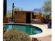 Inviting pool area with decorative brickwork, desert plants, and mountain views in the distance at 9607 E Mckellips Rd, Mesa, AZ 85207