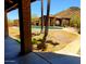 View of the private pool and covered patio area with desert landscaping and a scenic mountain backdrop at 9607 E Mckellips Rd, Mesa, AZ 85207