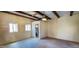 Open layout with exposed ceiling beams and access to bathroom at 9607 E Mckellips Rd, Mesa, AZ 85207