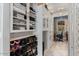 This walk-in closet has ample storage for both shoes and clothing with a view to the office at 9607 E Mckellips Rd, Mesa, AZ 85207