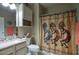 Cozy bathroom featuring a granite counter, neutral walls and a shower with patterned curtain at 9750 N Monterey Dr # 71, Fountain Hills, AZ 85268