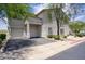 Well-maintained building exterior with attached garages, mature landscaping, and a clean, inviting facade at 9750 N Monterey Dr # 71, Fountain Hills, AZ 85268