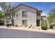 Charming two-story apartment exterior with well-maintained landscaping, stairs to a covered balcony, and a serene atmosphere at 9750 N Monterey Dr # 71, Fountain Hills, AZ 85268
