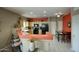 Stylish kitchen with an eat-in bar, modern appliances, and an adjacent dining area perfect for entertaining at 9750 N Monterey Dr # 71, Fountain Hills, AZ 85268