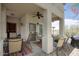 Cozy covered patio with outdoor seating, a ceiling fan, and a grill perfect for relaxing and entertaining at 9750 N Monterey Dr # 71, Fountain Hills, AZ 85268