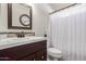 Cozy bathroom featuring modern fixtures, warm vanity, and decorative accents at 10465 W Windsor Blvd, Glendale, AZ 85307