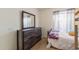 Comfortable bedroom featuring modern fixtures and a matching dresser at 10465 W Windsor Blvd, Glendale, AZ 85307