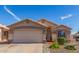 Charming single-Gathering home featuring a two-car garage, well-maintained landscaping, and a welcoming entrance at 10465 W Windsor Blvd, Glendale, AZ 85307