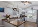 Bright kitchen featuring granite countertops, modern appliances, and ample natural light from a large window at 10465 W Windsor Blvd, Glendale, AZ 85307