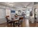 Open dining area seamlessly connects to a modern kitchen with stainless appliances and ample counter space at 10465 W Windsor Blvd, Glendale, AZ 85307