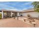 Backyard patio area featuring ample seating and brick detail at 10849 E Elmwood St St, Mesa, AZ 85207