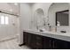 Modern bathroom features double vanity sinks, custom mirrors, and large walk-in shower at 10849 E Elmwood St St, Mesa, AZ 85207