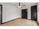 Bedroom with ceiling fan, built-in wardrobe and light wood flooring at 10849 E Elmwood St St, Mesa, AZ 85207