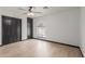 Bedroom with ceiling fan, built-in wardrobe and light wood flooring at 10849 E Elmwood St St, Mesa, AZ 85207