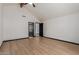 Primary bedroom features wood beam, ceiling fan, and light wood flooring at 10849 E Elmwood St St, Mesa, AZ 85207
