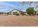 Charming white brick home featuring an attached garage and mature landscaping at 10849 E Elmwood St St, Mesa, AZ 85207