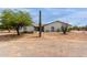 Charming single-story home with a desert landscape, white brick, and a striking saguaro cactus at 10849 E Elmwood St St, Mesa, AZ 85207