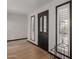 Foyer showcasing wood floors, a stylish front door, and windows with shutter detail at 10849 E Elmwood St St, Mesa, AZ 85207
