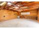 Unfinished garage interior featuring cabinets and ample workspace at 10849 E Elmwood St St, Mesa, AZ 85207