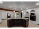 Kitchen island with seating, granite countertops, and modern pendant lighting at 10849 E Elmwood St St, Mesa, AZ 85207