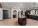 Kitchen showcasing black cabinetry and granite countertops with a decorative island at 10849 E Elmwood St St, Mesa, AZ 85207