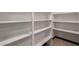 Spacious pantry features bright white shelving and tile flooring at 10849 E Elmwood St St, Mesa, AZ 85207