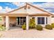 Charming outdoor patio area with seating, ideal for relaxing and entertaining with desert landscaping at 11807 E Clinton St, Scottsdale, AZ 85259